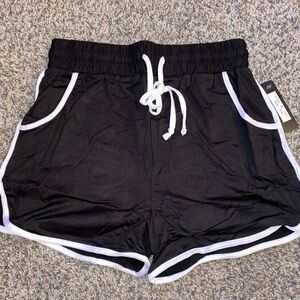 Black and White Athletic Shorts with Dolphin Hem